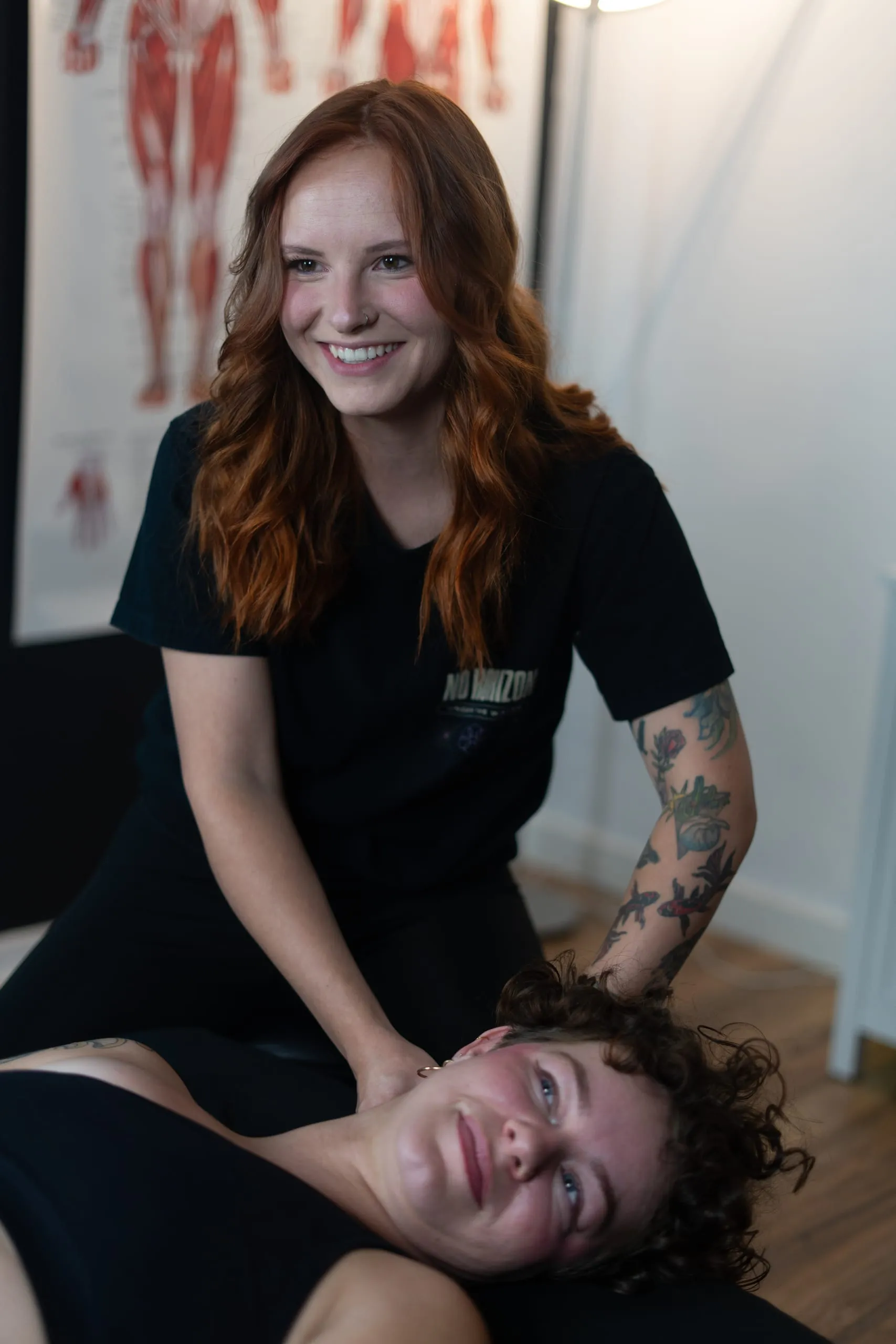 Isabelle smiling with a client during a session